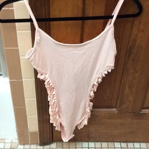 Fashion Nova pink bodysuit.